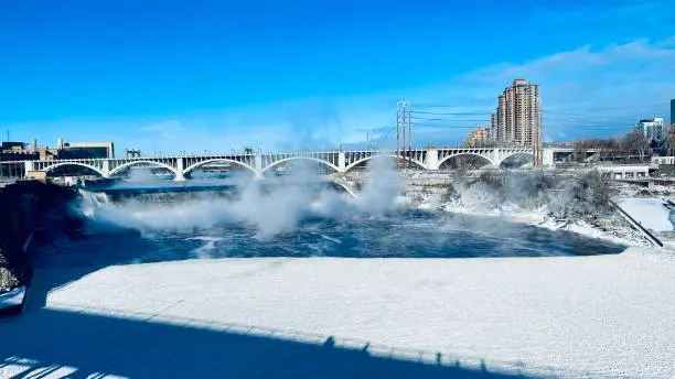 Cyclists riding along a scenic trail in Minneapolis, showcasing the city's extensive network of cycling routes and opportunities for outdoor recreation